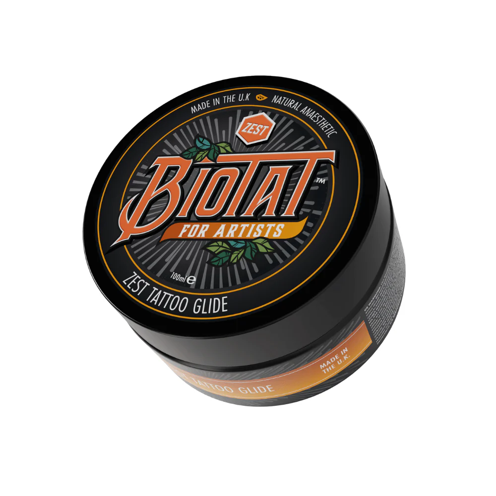 Biotat Zest Numbing Tattoo Glide in 100g and 500g tubs – vegan citrus-infused tattoo balm designed to reduce pain and soothe skin during tattooing. saviour tattoo supplies